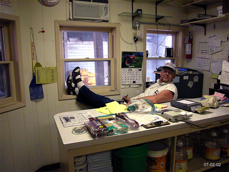 Unidentified man at the main office in the feed mill in Grasston Minnesota, 2002