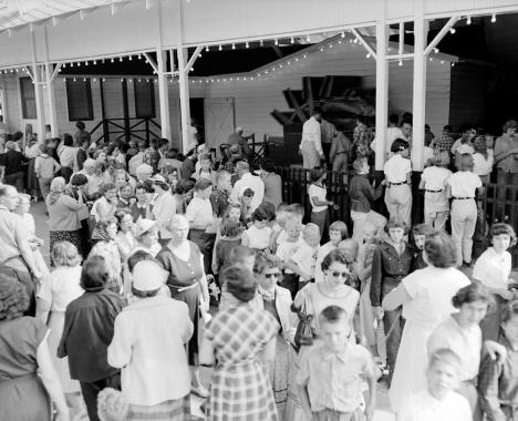 A crowd at Ye Old Mill at the Minnesota State Fair, 1956
