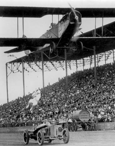 Lillian Boyer ascending a rope in a car-to-plane stunt at the Minnesota State Fair, 1922