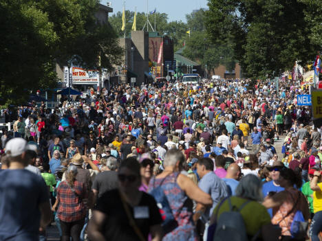 A crowd packs onto the street on the opening day of the Minnesota State Fair on Thursday, Aug 22, 2019