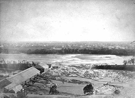 Looking west across the river from St. Anthony to Minneapolis; Hennepin Island and its sawmills at lower left, 1855.