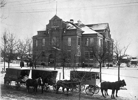 School wagons and main building, Alexandria Consolidated Schools, 1905