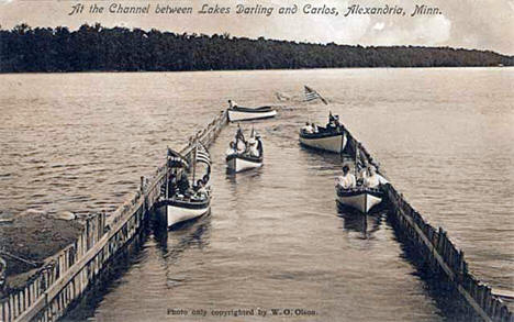 Boats in the channel between Lakes Darling and Carlos, near Alexandria, 1910