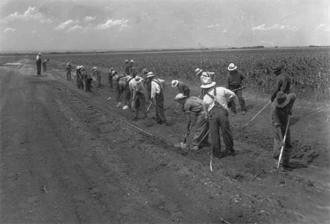 Drought farmers working on farm to market road in Foster township, south of Beardsley, 1936