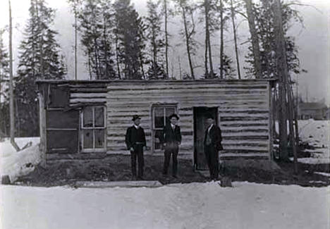 Edward McCann and others standing in front of parsonage at Big Falls, 1909