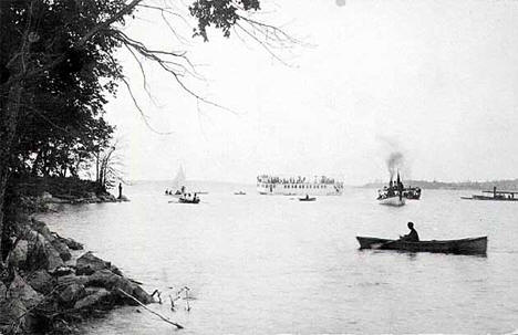Boats and steamer on Cass Lake, Cass County, 1910