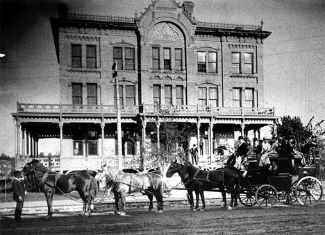 Coaching party from Minneapolis in front of Brunswick Hotel, 105-111 Central Avenue North, Faribault Minnesota, 1885