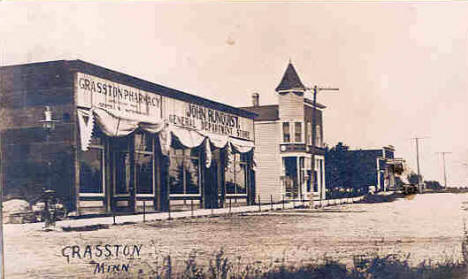 View of Grasston Minnesota showing Grasston Pharmacy, and John Runquist General Department Store, 1910