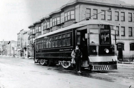 The Mesaba Railway ran streetcar service between Hibbing and North Hibbing. This car is posed at the north end of the line in front of the Oliver Hotel on 3rd Avenue in North Hibbing. 1921