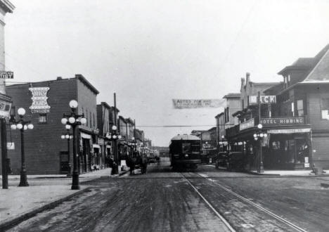Mesaba Ry. Interurban train on 3rd Ave. in old Hibbing, later named North Hibbing when the town was moved for iron ore mining. 1915.