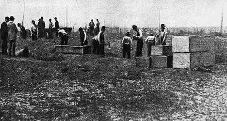 Burying the dead after fire, 90 in one trench, Hinckley Minnesota, 1894