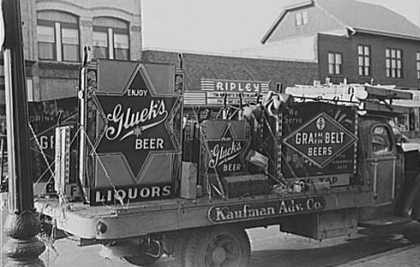 Truck loaded with beer signs, Little Falls Minnesota, 1940