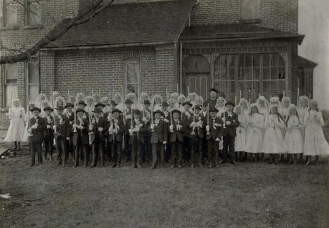 First Communion Class with Rev. Martin Schmidt, OSB in Meire Grove, MN in Church of St. John the Baptist, 1922