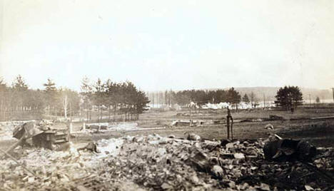 Ruins of Moose Lake following the fire; Minnesota Home Guard camp in the distance, Moose Lake Minnesota, 1918