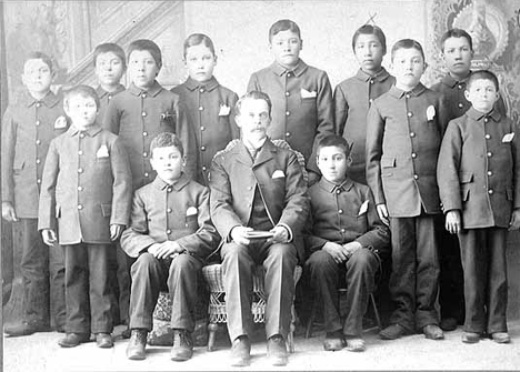 Teacher and students, Morris Indian School, Morris Minnesota, 1895