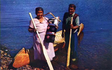 Chippewa Indian family and a birchbark canoe, Onamia Minnesota, 1955