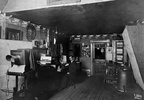 Ross Daniels in his Pine City studio, 1915
