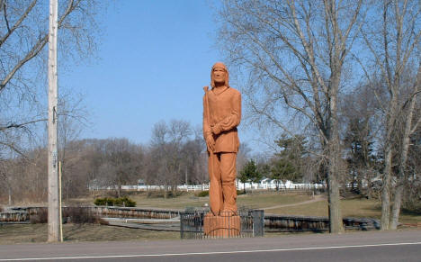 Pine City's 35 foot redwood voyageur statue in Riverside Park