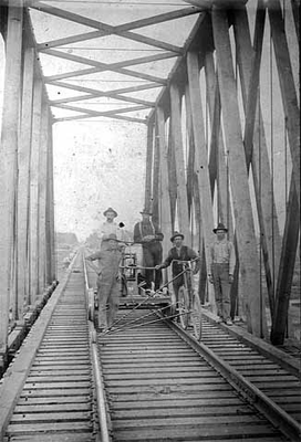 Railroad handcar and workers on Northern Pacific Railway bridge, Swanville, 1895