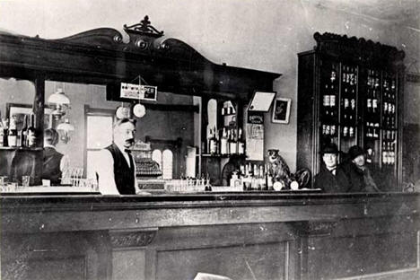 Visitors and bartender inside the Harris Saloon, Tenstrike Minnesota, 1905