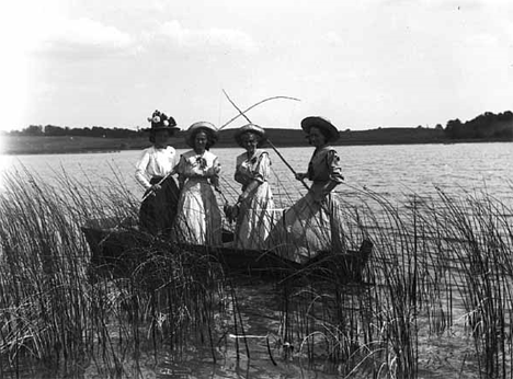 Women fishing from boat, Underwood Minnesota, 1910