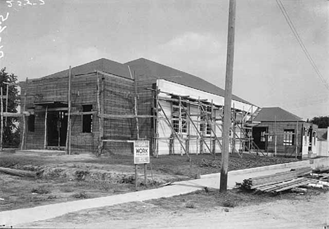 New community building under construction, Winger Minnesota, 1936