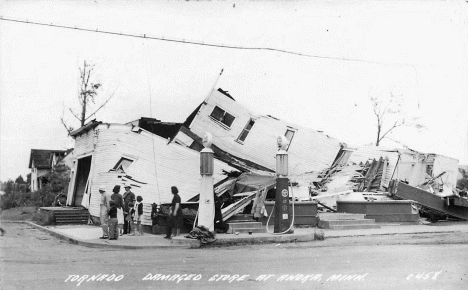 Damaged store after tornado hit, Anoka Minnesota, 1939