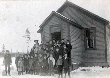Esko one-room schoolhouse, with teacher and students, Esko Minnesota, 1907