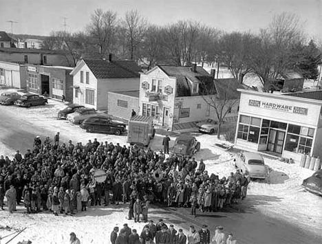 Crowd of people on Pemberton's Main Street, Pemberton Minnesota, 1957
