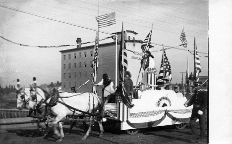 Parade on Main Street Bridge with Lincoln Mill in background, Anoka Minnesota, 1911