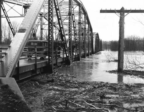 Flooding of the Minnesota River as seen from the old iron truss bridge outside Belle Plaine, Minnesota on April 11, 1951