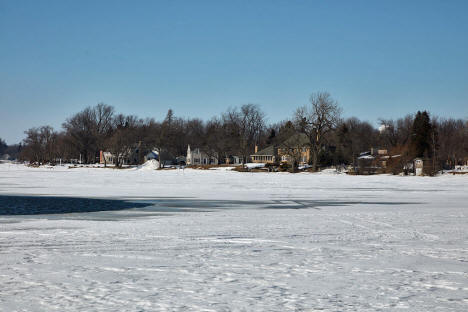 Homes along partially frozen Lake Okabena in Worthington Minnesota, 2020